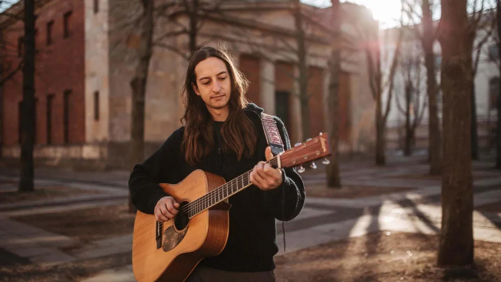 Adam Wendler playing guitar