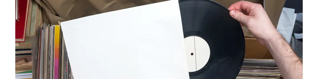 Hand pulling a record out of a sleeve