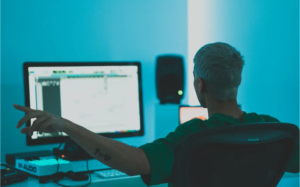 person in studio in front of screen