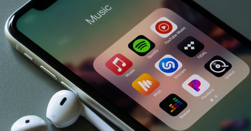 iPhone screen showing Music app folder with various music apps including Spotify, Shazam, and others, with white earbuds connected.