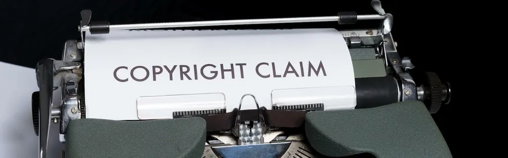 typewriter with paper that says copyright claim