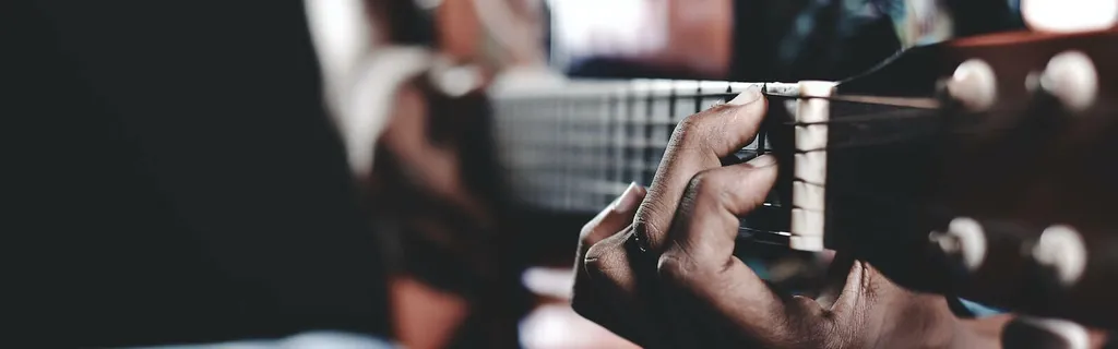 hands playing guitar