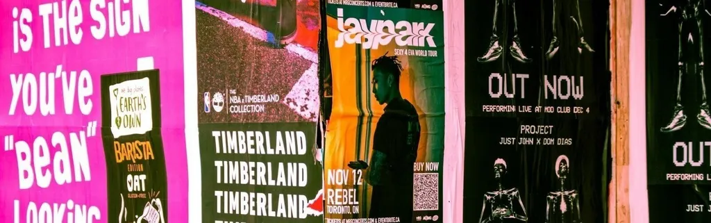 music posters hanging on wall