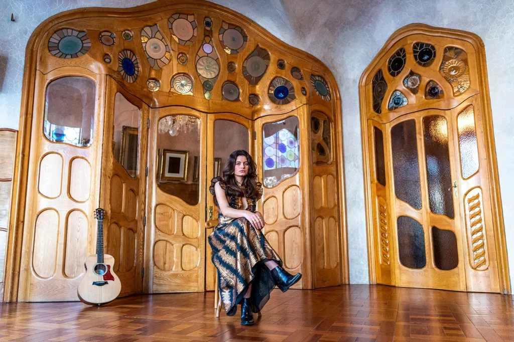 Cece June artist photo with her guitar