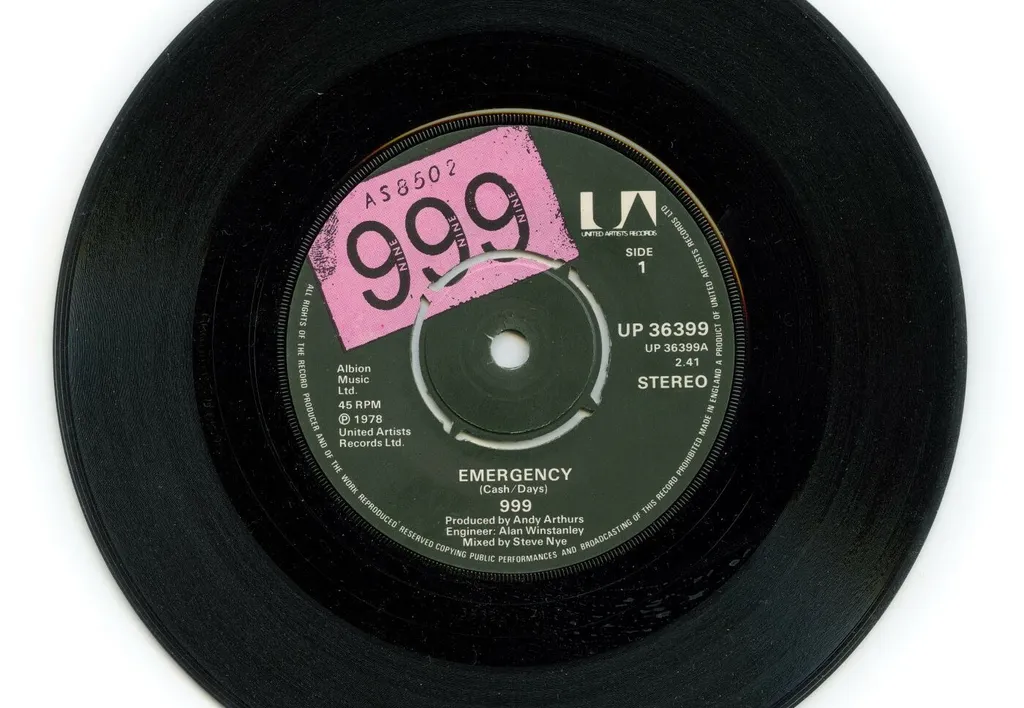 Music metadata and label copy printed in the center of an old vinyl